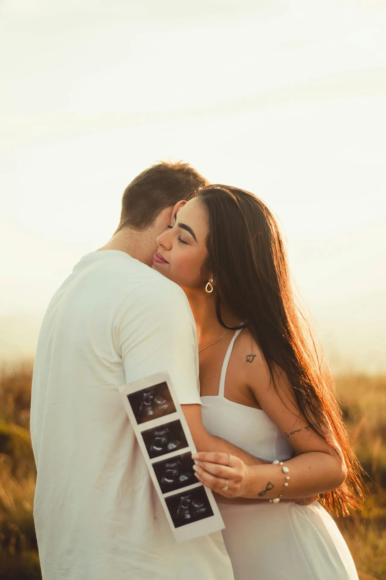 couple embracing with ultrasound
